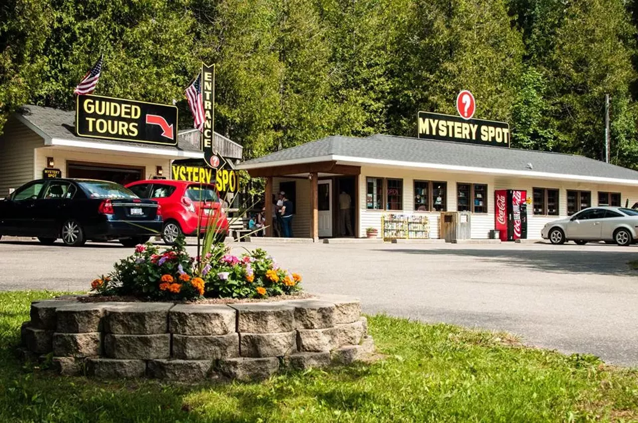 St. Ignace Mystery Spot St. Ignace, MI Shows gravity in a different way. Features optical contradictions and weird physical sensations. Shows buildings turned in weird angles to give an unbalanced effect. Other activities include zip lining and putt putt golf. Photo via atlasobscura.com