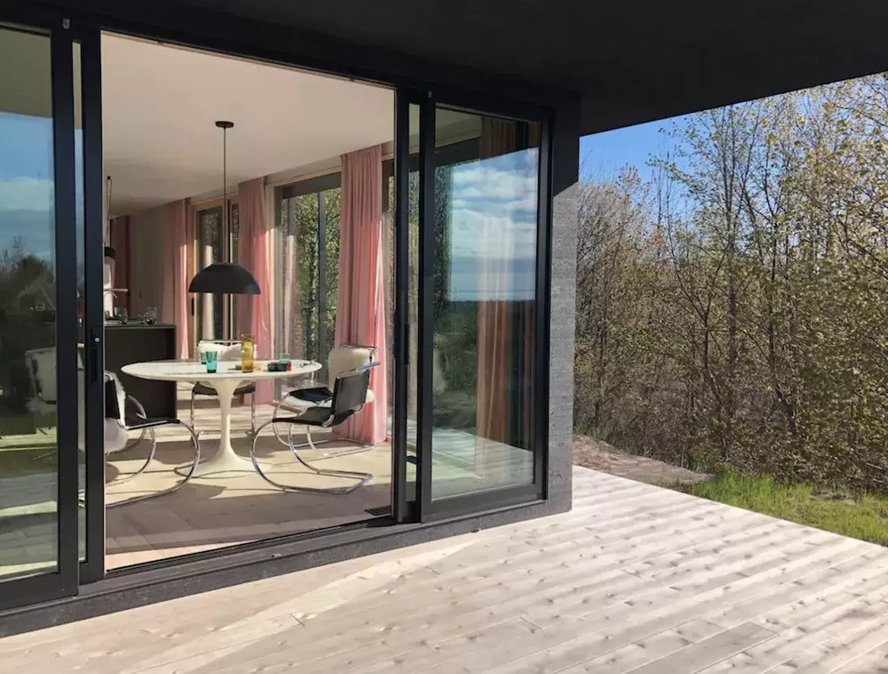 Seeblick Haus in Northport 6 guests, 3 bedrooms, 3 beds, 2 baths $410 per night Get your camera ready, honey: this house is ready for its closeup. Located on a 12-acre lot, this 2019 contemporary modernist cabin in Northport offers privacy and a 270 degree view of Grand Traverse Bay and the surrounding orchards. Offering an open floor plan, the Seeblick Haus boasts floor-to-ceiling windows and sleek design touches like a rain shower, an indoor wood-burning stove, and a color scheme that looks like a goddamn delicious pack of Starbursts. Within five miles of the home, there is access to Lake Michigan beach fronts, a goat farm, vineyards, doughnuts, a small-town grocer, and ice cream. Photos via Airbnb.com