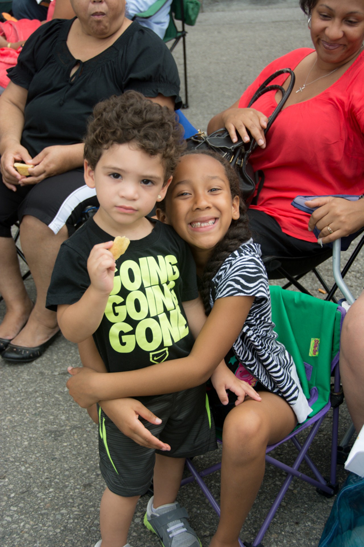 Gabrielle Figueroa gives her cousin, Jeremiah a giant hug while listening to a Dizzy Gillespie piece.
