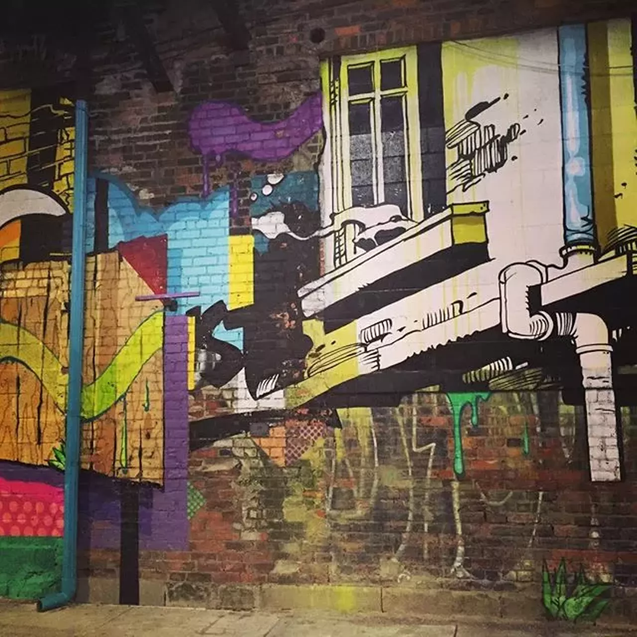In front of graffiti Art takes on a variety of forms. Whether it&#146;s actually on a canvas or on a wall, art is art. Some graffiti can be crude, but there are some decent murals occupying various buildings throughout the city that can help set the make out mood. (Photo courtesy of instagram user tlisaacs)