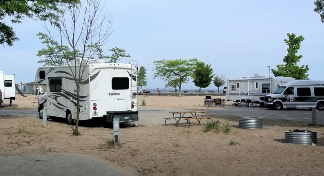 Mears State Park
Pentwater; 231-869-2051; dnr.state.mi.us
Park, open your door, dig your toes into the sand, swim in Lake Michigan, repeat. Grab a spot at the foot of the sand dunes and then take a hiking trail to the top at this Michigan camping spot. The secluded park is right next to the sandy beach and beautiful lake, but also minutes away from downtown Pentwater, where you'll find shops, a boardwalk, pier, and lighthouse.
Photo via Screengrab/YouTube