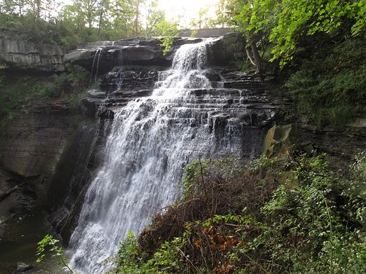 The Cuyahoga Valley National Park
    Estimated time: 2 hours, 41 minutes 
    Situated between Cleveland and Akron, there's actually something pretty beautiful. The Cuyahoga Valley National Park is filled with waterfalls, rolling hills, caves, ravines, and winding rivers. The Ledges provides a boulder-strewn cliff to relax and watch the sunset over the wooded scenery below, and the park offers an array of preserved and restored displays of 19th and early 20th century sustainable farming and pastoral or rural living, while catering to contemporary interests with art exhibits, outdoor concerts, and scenic excursion and special event railroad tours.