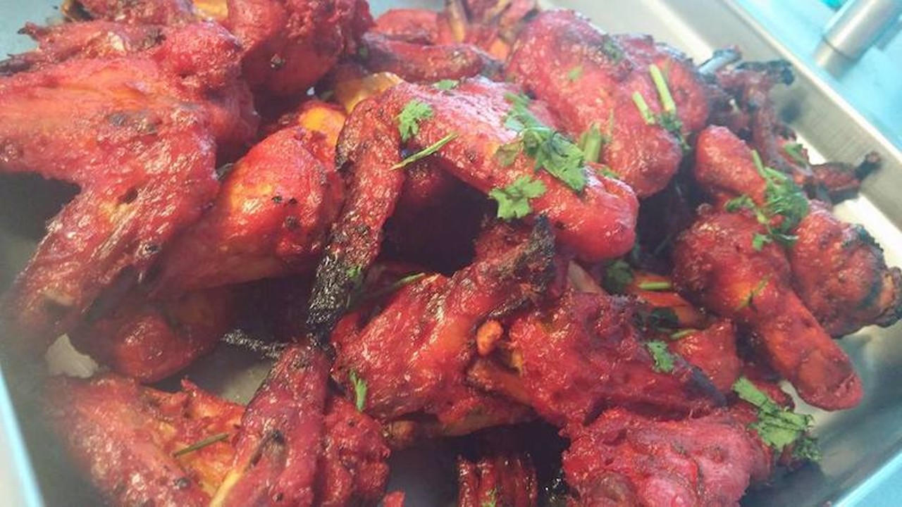 ZamZam
11917 Conant St., Hamtramck; 313-893-9902; 
The Bangladeshi tandoori chicken wings are stained bright red from the mix of masala, cayenne, and other spices, and the meat falls from the bone after an extended stay in the clay oven.
Photo via ZamZam Restaurant / Facebook