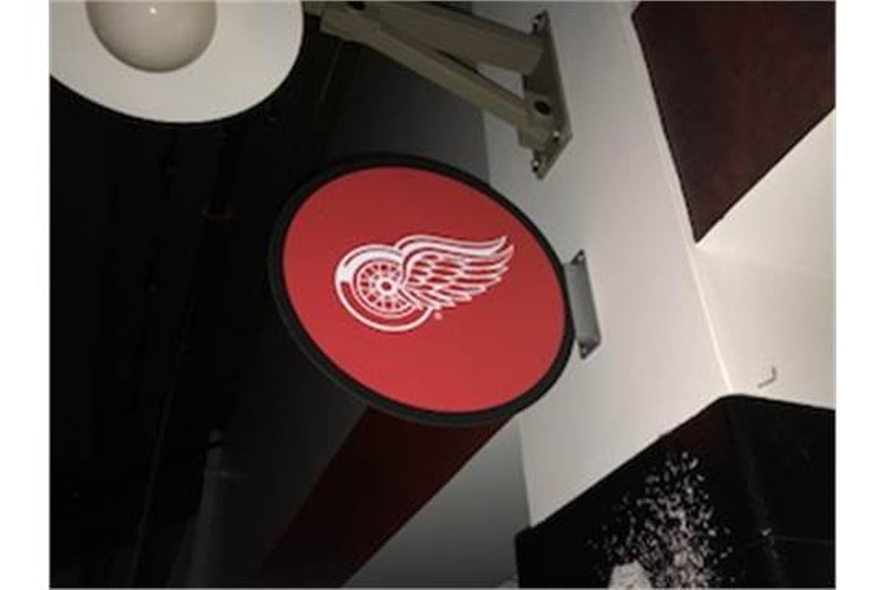 Wing on hockey pick sign.