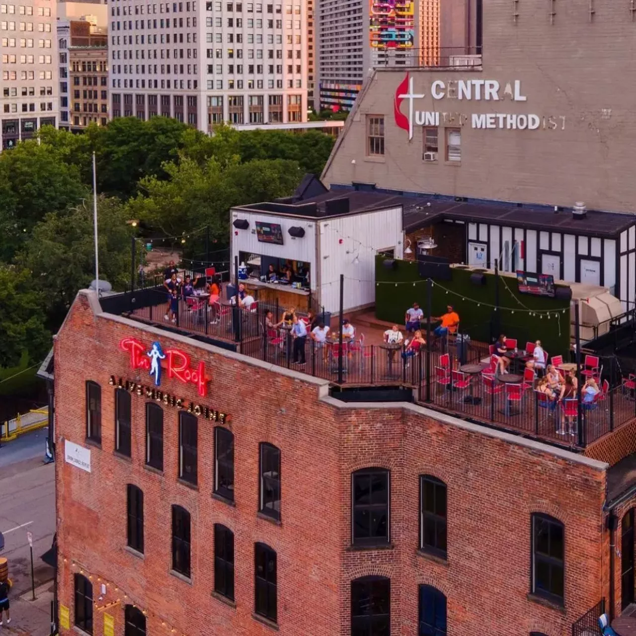 Tin Roof Detroit - 47 East Adams Ave., Detroit This live-music bar chain opened a Detroit location right outside of Comerica Park in 2020, replacing Cheli's Chili. Now, Tin Roof Detroit gives Tigers fans a great place to pre-game and post-game with good food, drinks, and fun. 