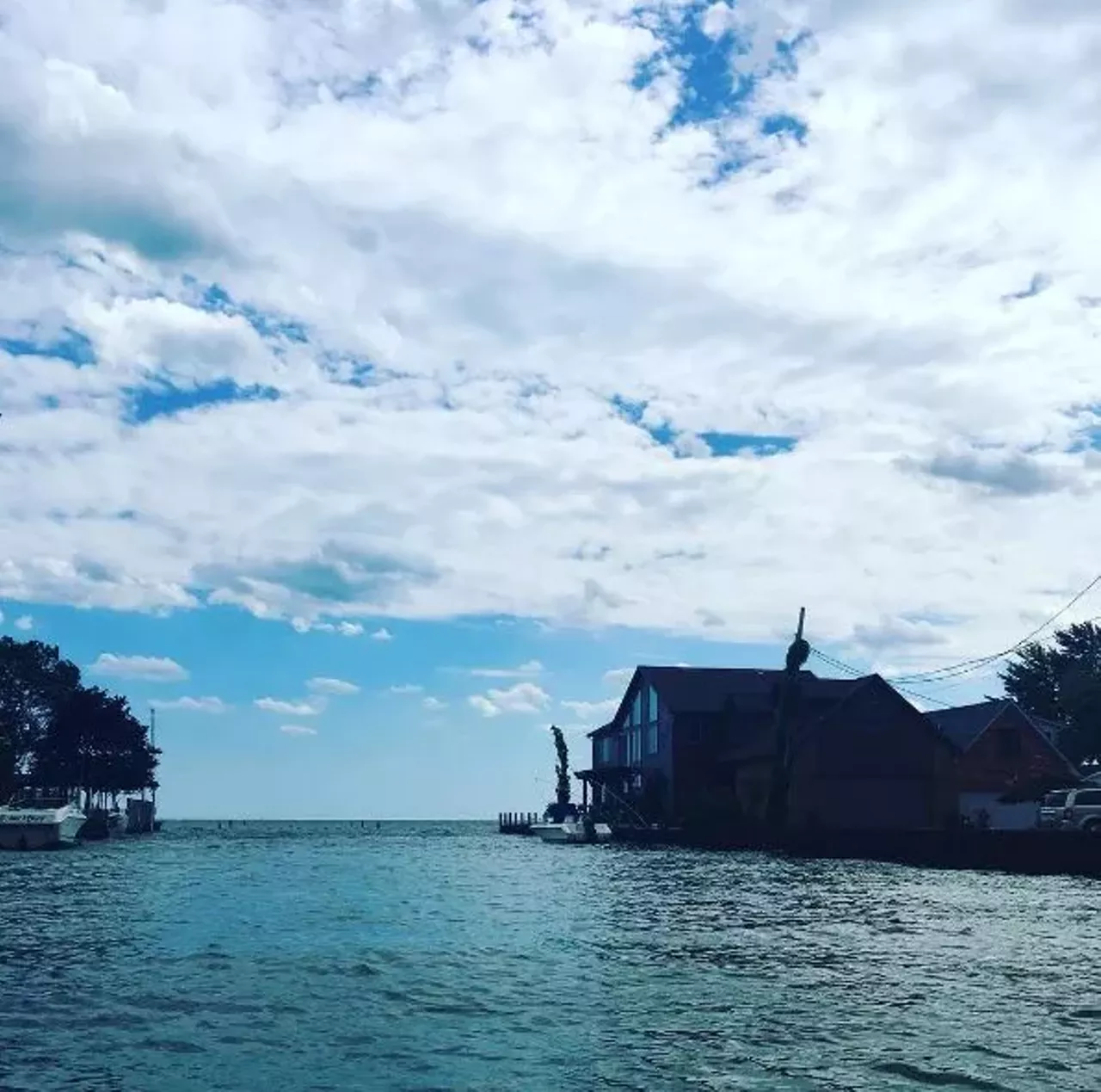 New Baltimore 40 minutes from Detroit Located smack-dab in the middle of Anchor Bay on Lake St. Claire, New Baltimore is a great distillation of the Michigan experience. The New Baltimore Farmer&#146;s Market runs from mid-May to mid-October, and features an excellent variety of homegrown products. Photo via IG user @kimberlyjanderson.