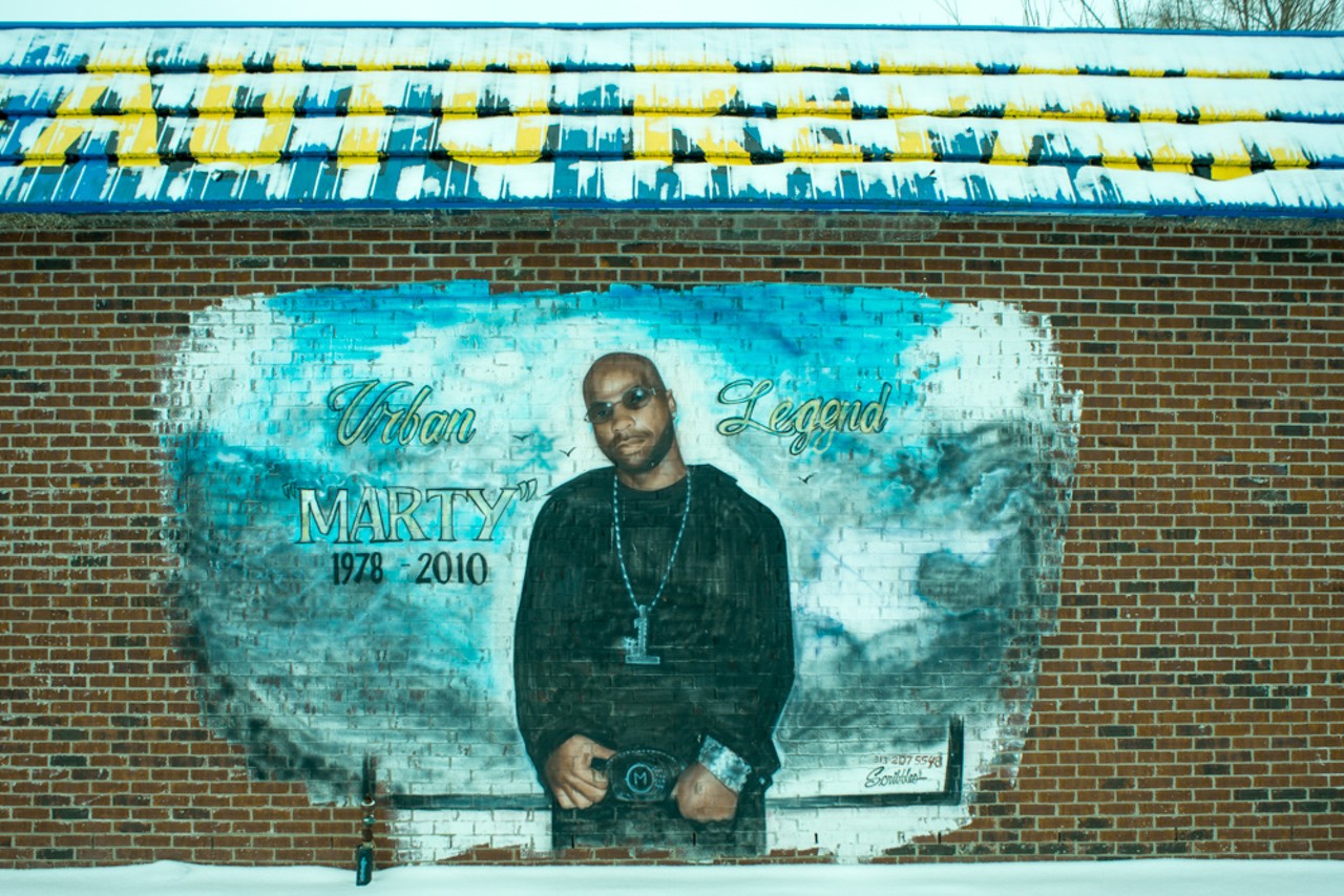 Marty on the side of Kal II Auto Repair Shop. Marty died of a rare blood disease that afflicted his whole family.  Memorial by Scribbles,  E. Warren Ave. at Lenox, Detroit, 2014.