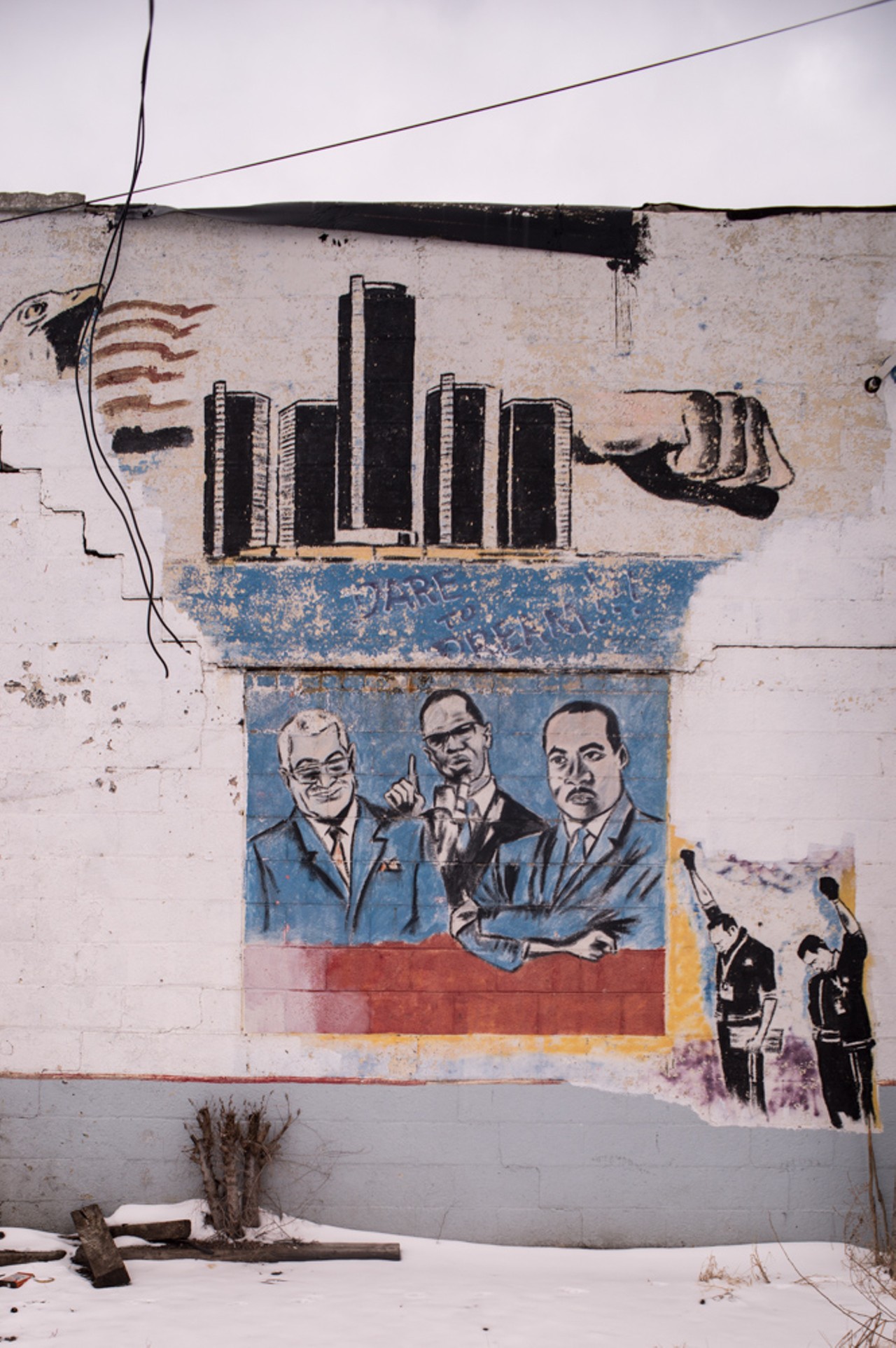 &#147;Dare to Dream&#148; mural depicting Coleman Young, Malcolm X and MLK Jr., as well as gold medallist Tommie Smith and bronze medallist John Carlos making the Black Power salute during the 1968 Mexico City Summer Olympics. Muffler shop, Cloverdale at Elmhurst, Detroit, 2015.