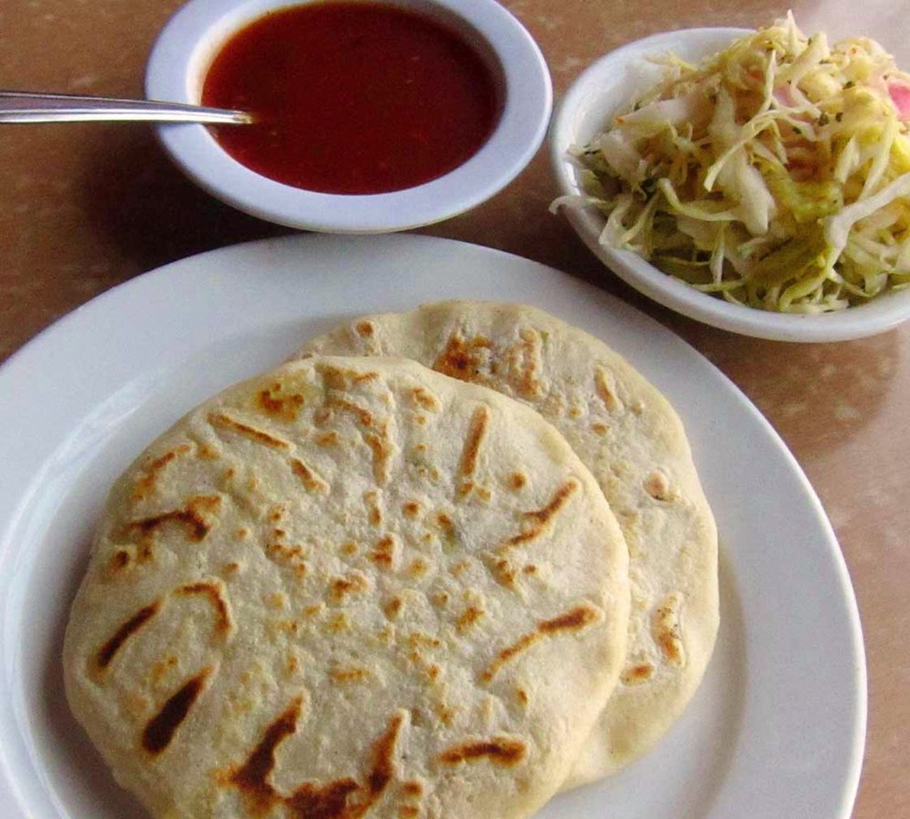 Pupusas | Pupuser&iacute;a y Restaurante Salvadore&ntilde;o  | $2.50/pupusa 
Detroit | 3149 Livernois Ave. | (313) 899-4020 
A pupusa is a flat pancake stuffed with an assortment of different meats and/or cheeses. The menu is extensive and the possible combinations are limitless. 
(Photo: