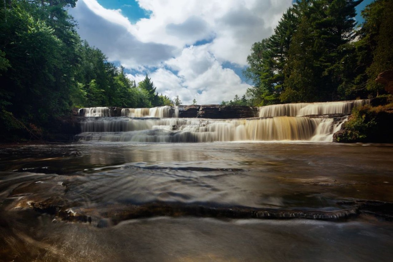 Tahquamenon Falls State Park41382 W. M-123, ParadiseLocated right at the tippy top of the U.P. you can find Tahquamenon Falls State Park. It&#146;s known for its main waterfall along the Tahquamenon river, which is an ample photo-op spot for campers and those who just come for a visit. Popular activities campers can pursue include hiking, fishing, backpacking, canoeing, and photography. During the summer, campers can take a guided hike with the park&#146;s staff throughout the week.
Photo via  Tahquamenon Falls State Park / Facebook