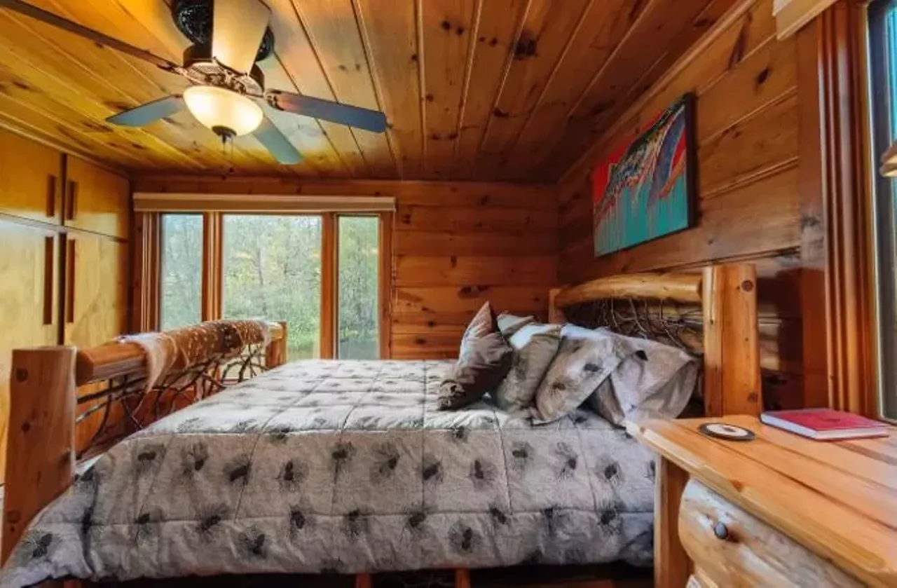 The Royal Stag Lodge (Grayling) 16+ guests, 6 bedrooms, 3.5 baths $1,043 per night&nbsp; Dating to the 1940s, this one-of-a-kind spot has exposed beams, custom metal railings, mounted animal heads, and authentic pelts.&nbsp; Photo via Airbnb