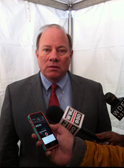 Detroit Mayor Mike Duggan talking with reporters after a press conference on Jan. 13, 2015 announcing the redevelopment of the Strathmore Hotel in Detroit's Midtown district. - RYAN FELTON/METRO TIMES