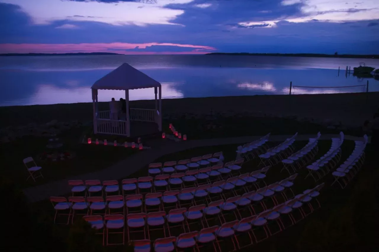 Park Shore Resort: An outdoor wedding venue, Park Shore Resort offers a lakefront view from its wedding gazebo. After the ceremony, move to the outdoor reception deck and check out the cuisine of local vendors. Situated in Traverse City, this wedding getaway will provide guests with the rich culture and activities of the city. Located at 1401 US 31, North Traverse City. Photo via www.parkshoreresort.com.