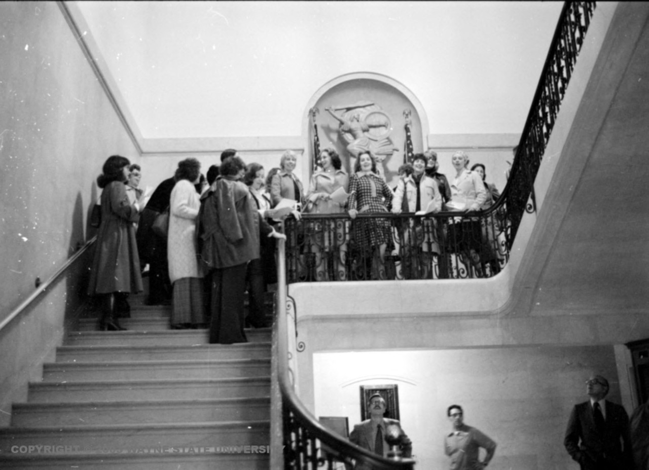 1970s | Group of women from the National Organization for Women stand on steps inside the Detroit Athletic Club.