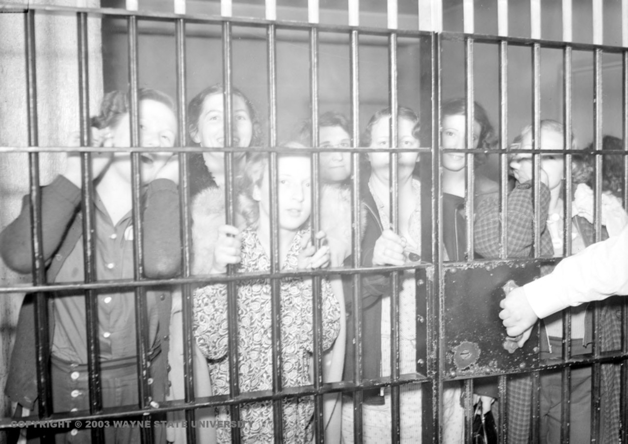 1930s | Striking female employees of Yale & Towne Manufacturing Comapny stand behind bars of jail cell. "In the Thirties, Yale & Towne resisted unionization so bitterly that it closed a plant in Detroit rather than deal with a union, at one point a federal judge censured the company for its anti-labor activity," from Rainbow at Midnight: Labor and Culture in the 1940s, by George Lipsitz.