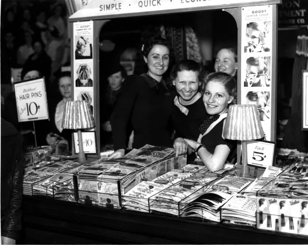 1930s | Striking workers pose at hair care products display at Woolworth store in Detroit, Michigan, during sit-down strike.