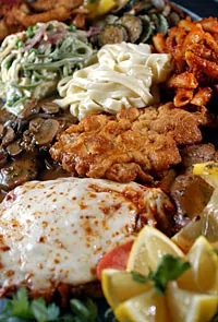 A selection of veal dishes including Veal Parmesan, veal lemon, veal tosca, and veal Marsala, as well as fettucine Alfredo, mostaccioli, and paglia and fieno from Roma Cafe in Detroit. - Metro Times photo/Rob Widdis
