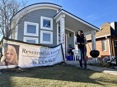 Taura Brown speaks to reporters and housing rights activists about her plan to fight her eviction.