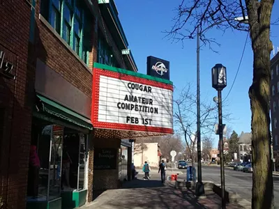 A sign at Ypsilanti’s Deja Vu Showgirls advertising a “cougar amateur competition.”