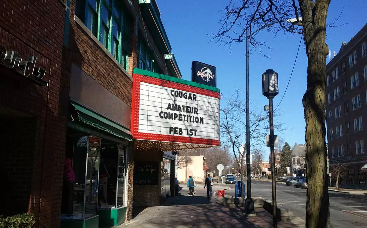 Image: A sign at Ypsilanti’s Deja Vu Showgirls advertising a “cougar amateur competition.”
