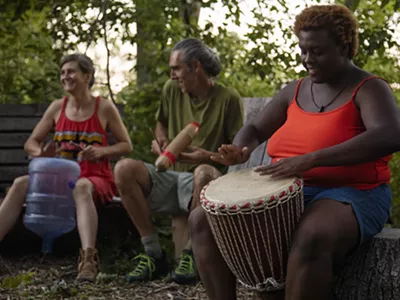 A jam session in Circle Forest. Andrew "Birch" Kemp (center) founded Arboretum Detroit in 2019.