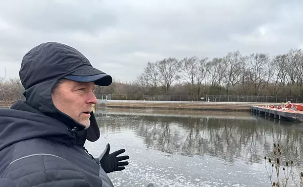 Scott Whitney, of the Army Corps of Engineers, is on the banks of Des Plaines River. This area will be the first stage of construction on the Brandon Road Interbasin Project.