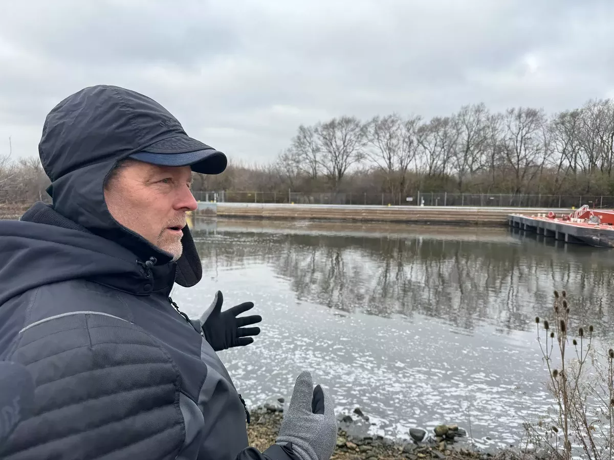 Image: Scott Whitney, of the Army Corps of Engineers, is on the banks of Des Plaines River. This area will be the first stage of construction on the Brandon Road Interbasin Project.