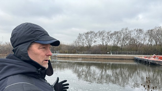 Scott Whitney, of the Army Corps of Engineers, is on the banks of Des Plaines River. This area will be the first stage of construction on the Brandon Road Interbasin Project.