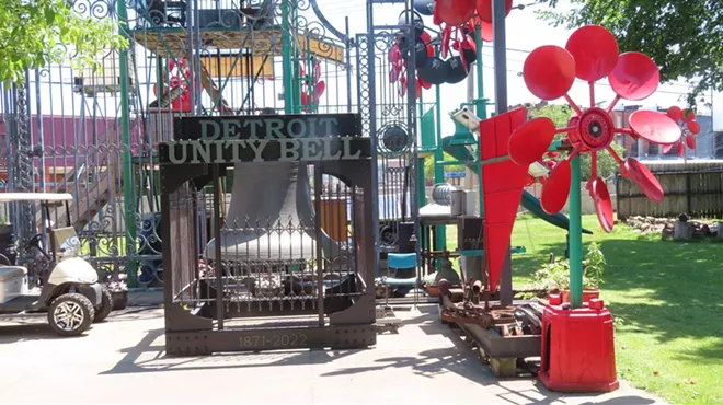 The Detroit Unity Bell among a forest of Detroit Windmills, at C.A.N. Art Handworks on Wilkins Street, prior to installation at Eastern Market in September 2022.