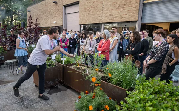 Stamps 2D media studio coordinator Nicholas Dowgwillo shows the new Sustainable Materials & Color Garden to students and faculty.
