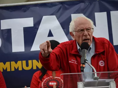 U.S. Sen Bernie Sanders (I-Vermont) spoke against ‘corporate greed’ and ‘record profits’ secured by the Detroit Three during a rally on Friday with striking UAW workers just 500 feet from the North American International Auto Show charity fundraising event.