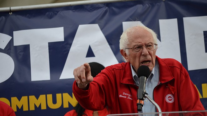 U.S. Sen Bernie Sanders (I-Vermont) spoke against ‘corporate greed’ and ‘record profits’ secured by the Detroit Three during a rally on Friday with striking UAW workers just 500 feet from the North American International Auto Show charity fundraising event.