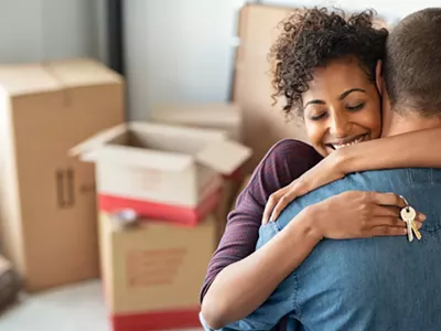 A photo showing a young couple moving in together.