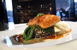 California Salmon with cherry chili glaze, baby bok choy on a rice cake, from Panache 447 in Plymouth.