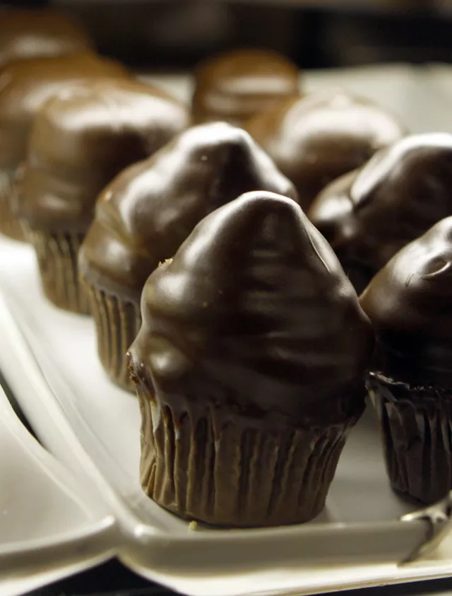 Chocolate bumpy cupcakes in the display case of Morning Glory in Grosse Pointe Farms