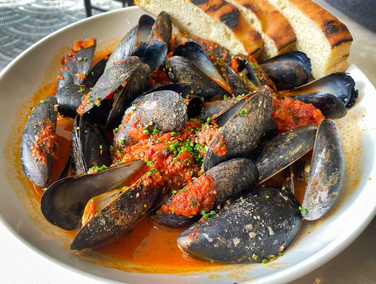 Ciao serves its mussels in a shakshuka sauce with merguez, essentially a Moroccan plate.