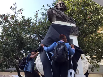 Protesters draped a black cloth over the Christopher Columbus statue in downtown Detroit in August 2017.