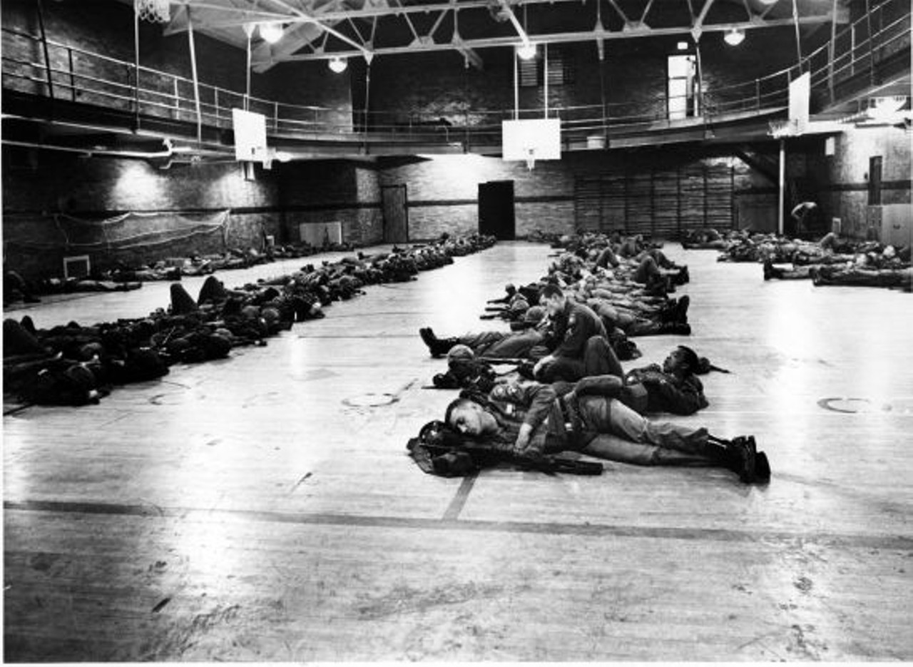 Troops deployed to Detroit camped at the state fairgrounds and in schoolyards across the city, occupying makeshift quarters wherever space could be found. In this photo, soldiers from the 82nd Airborne rest in the gym at Southeastern Junior High. 