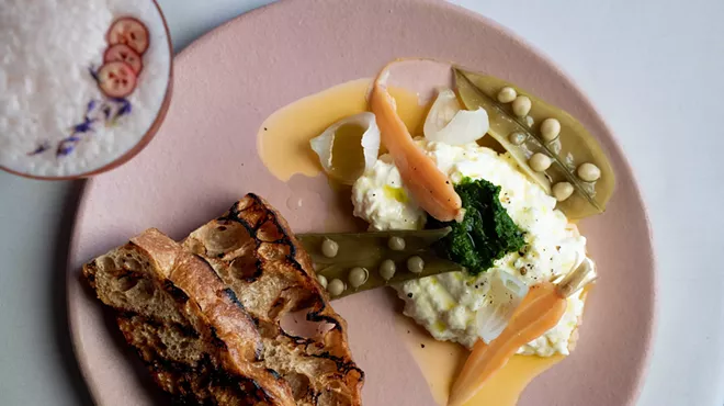 Stracciatella cheese served with pickled vegetables and grilled bread at Tiliani.