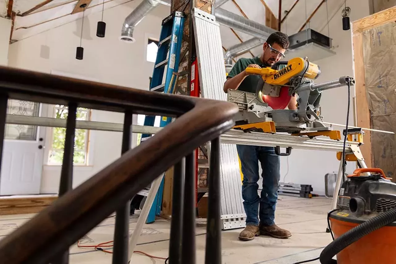 Antonio Holguin of Holguin Construction works on the second floor of the Design Build Green Tech Hub during the final stages of renovation, ahead of the grand opening.