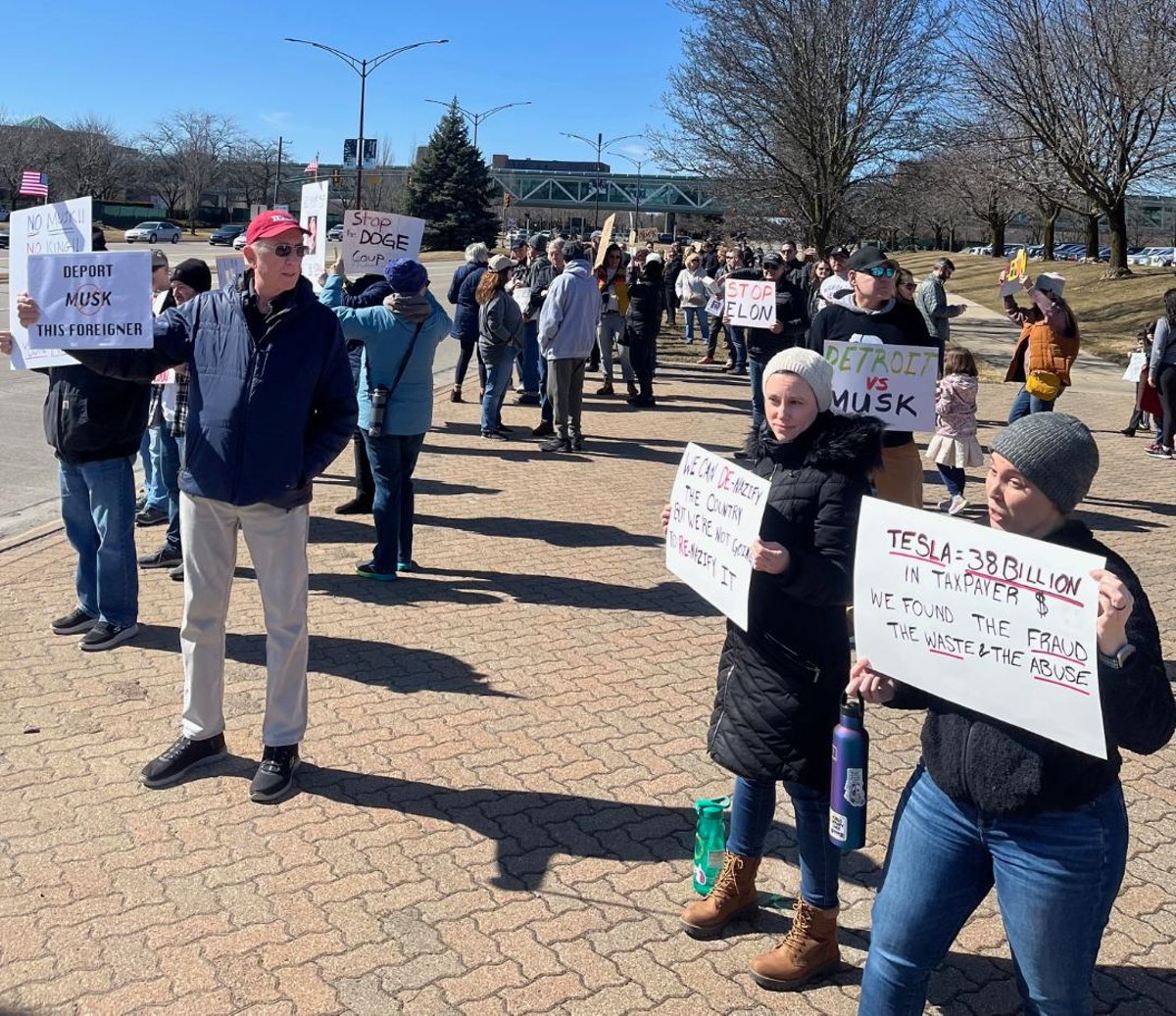 Image: “Tesla Takedown” protesters gather outside the Somerset Collection in Troy.