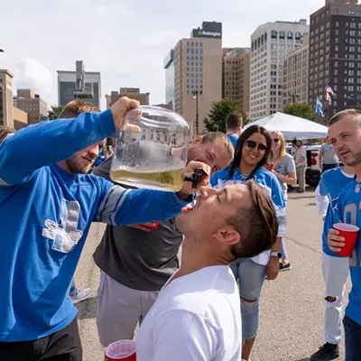 Image: Detroit Lions fans show team spirit at first home game of the season
