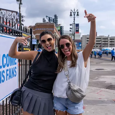 Image: Detroit Lions fans show team spirit at first home game of the season
