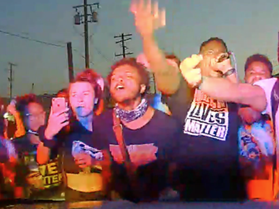 Screen grab of video inside Detroit police car that drove through a crowd of protesters.