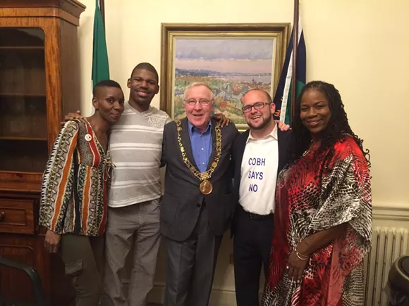 Christy Burke (center), the Lord Mayor of Dublin, with members of the Detroit Water Brigade (from left to right): Makita Taylor, DeMeeko Williams, Justin Wedes, and Shamayim Harris. - COURTESY OF THE DETROIT WATER BRIGADE