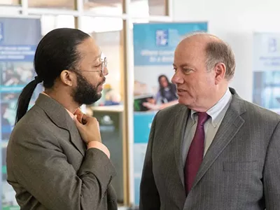 Detroit’s former “Chief Storyteller” Eric Thomas and Mayor Mike Duggan in 2020.