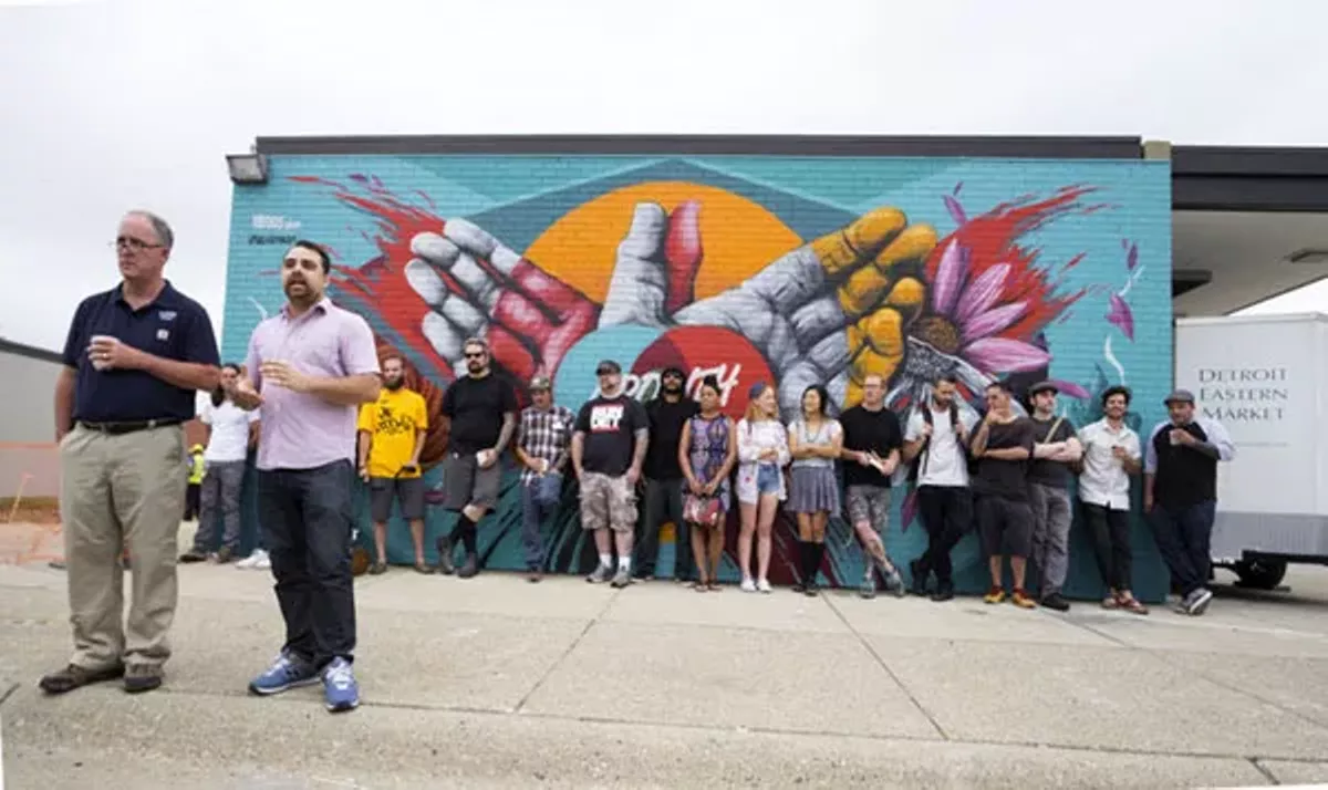 Image: Eastern Market director Dan Carmody, left, and 1xRUN co-founder Jesse Cory announce the artists for the Murals In The Market festival in 2015.