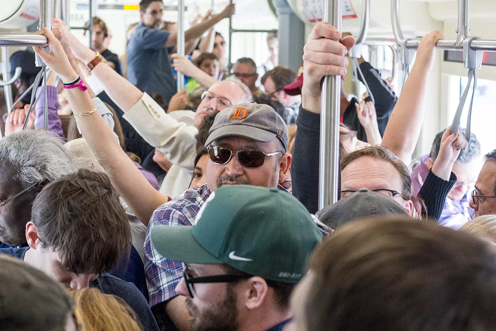 A crowded QLine car.
