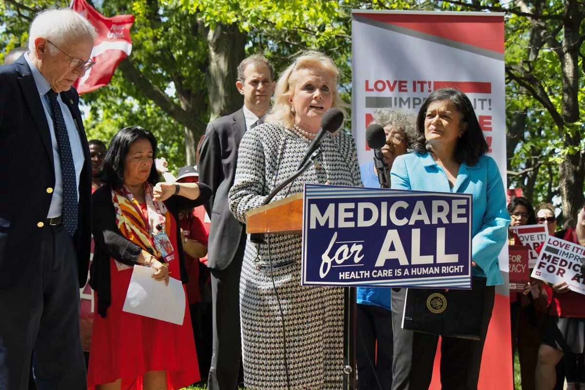 Image: From left: U.S. Senator Bernie Sanders, U.S. Rep. Debbie Dingell, and U.S. Rep. Pramila Jayapal introduce the Medicare for All Act of 2025.