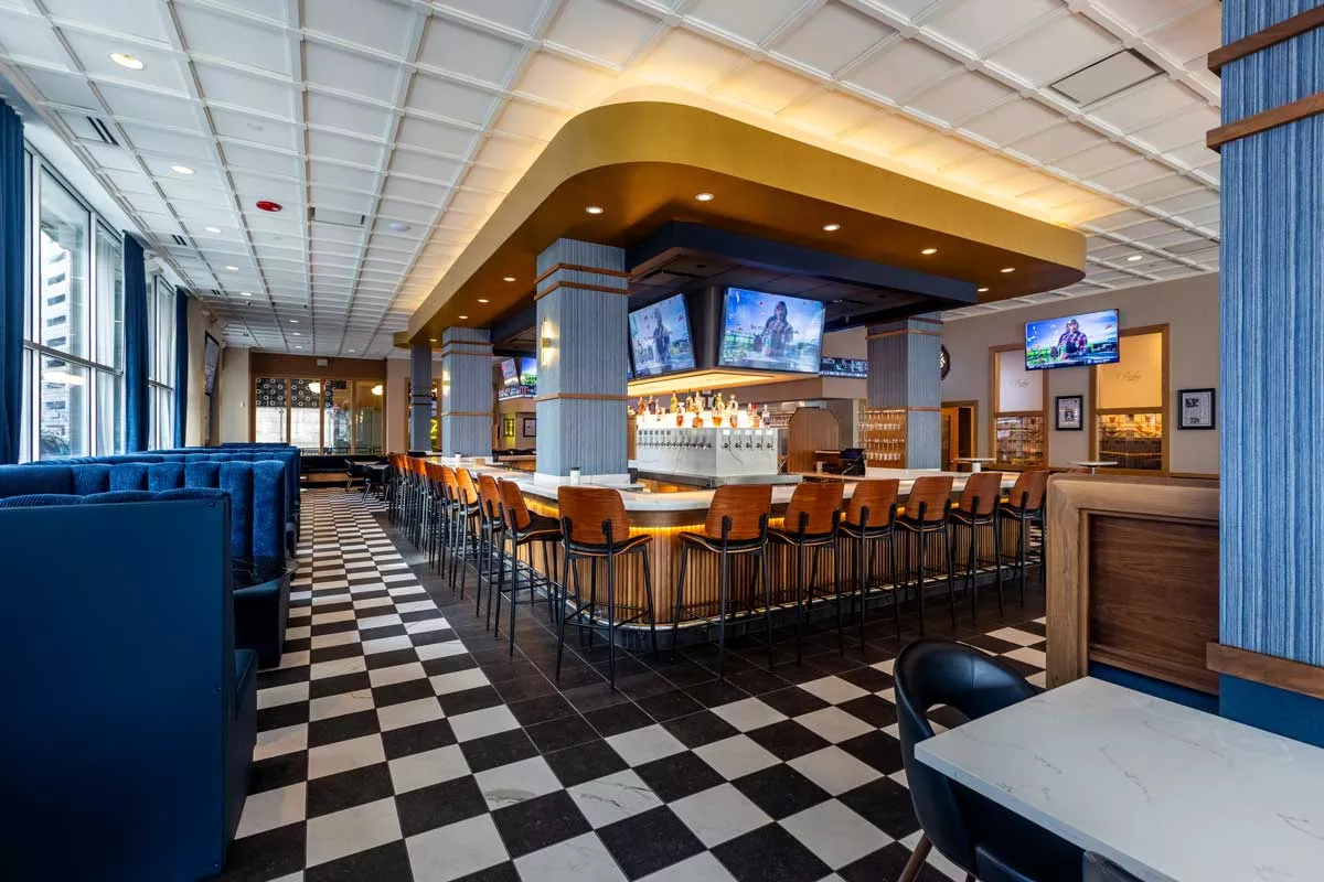 Image: Parlay is a sports fan paradise, decked out in sports tickers and large TV screens.